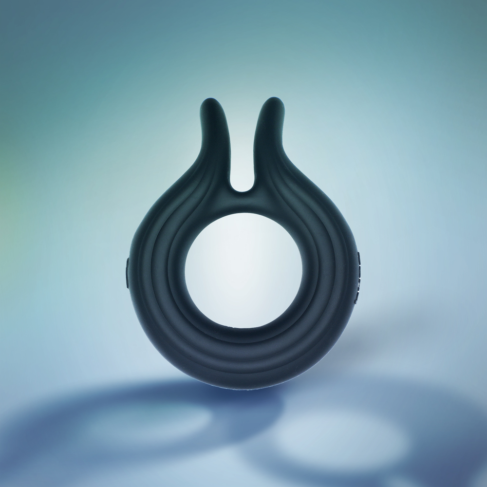 Hung Vibrating Couples Ring on blue background with shadows